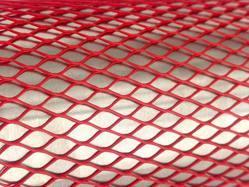 Extruded mesh tube — continuous plastic strand structure v